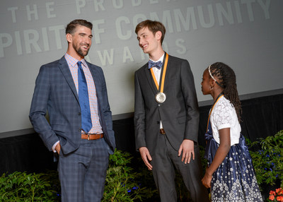 Olympic gold medalist Michael Phelps congratulates Adam Sella, 18, of Cincinnati (center) and Mackenzie Lewis, 10, of Columbus (right) on being named Ohio's top two youth volunteers for 2017 by The Prudential Spirit of Community Awards. Adam and Mackenzie were honored at a ceremony on Sunday, May 7 at the Smithsonian's National Museum of Natural History, where they each received a $1,000 award.