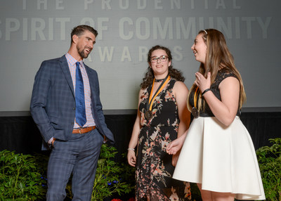 Olympic gold medalist Michael Phelps congratulates Leah Burian, 16, of Portland (center) and Carlie Steele, 12, of Amity (right) on being named Oregon's top two youth volunteers for 2017 by The Prudential Spirit of Community Awards. Leah and Carlie were honored at a ceremony on Sunday, May 7 at the Smithsonian's National Museum of Natural History, where they each received a $1,000 award.