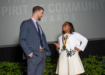 Olympic gold medalist Michael Phelps congratulates Harmonie Frederick, 11, of Columbia (right) on being named one of South Carolina's top two youth volunteers for 2017 by The Prudential Spirit of Community Awards. Harmonie was honored at a ceremony on Sunday, May 7 at the Smithsonian's National Museum of Natural History, where she received a $1,000 award.