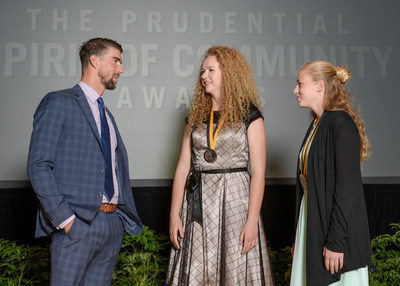 Olympic gold medalist Michael Phelps congratulates Rebekah Reno, 17, of Orem (center) and Kara Hughes, 13, of Bountiful (right) on being named Utah's top two youth volunteers for 2017 by The Prudential Spirit of Community Awards. Rebekah and Kara were honored at a ceremony on Sunday, May 7 at the Smithsonian's National Museum of Natural History, where they each received a $1,000 award.