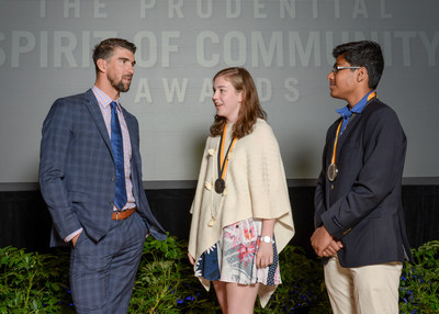 Olympic gold medalist Michael Phelps congratulates Lucia Hoerr, 17, of Charlottesville (center) and Shishir Sriramoju, 14, of Ashburn (right) on being named Virginia's top two youth volunteers for 2017 by The Prudential Spirit of Community Awards. Lucia and Shishir were honored at a ceremony on Sunday, May 7 at the Smithsonian's National Museum of Natural History, where they each received a $1,000 award.