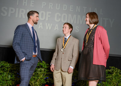 Olympic gold medalist Michael Phelps congratulates Rhett Pimentel, 17, of Powell (center) and Grace Estes, 14, of Farson (right) on being named Wyoming's top two youth volunteers for 2017 by The Prudential Spirit of Community Awards. Rhett and Grace were honored at a ceremony on Sunday, May 7 at the Smithsonian's National Museum of Natural History, where they each received a $1,000 award.