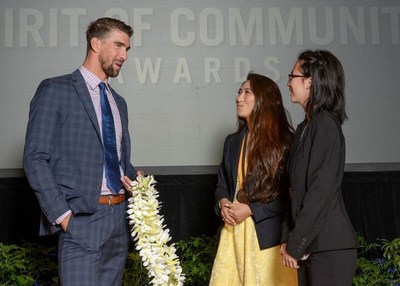 Olympic gold medalist Michael Phelps congratulates Cierra Nakamura, 18, of Honolulu (center) and Emma Tandara, 14, of Ewa Beach (right) on being named Hawaii's top two youth volunteers for 2017 by The Prudential Spirit of Community Awards. Cierra and Emma were honored at a ceremony on Sunday, May 7 at the Smithsonian's National Museum of Natural History, where they each received a $1,000 award.