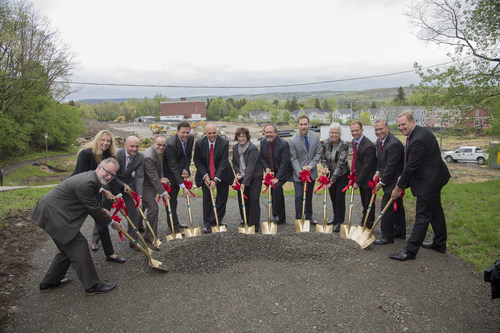 A group of dignitaries led by Cornell University President Martha Pollack (center) turn ceremonial dirt at a ceremony marking the start of construction of the Maplewood Graduate and Professional Student Housing, which is scheduled to open in Fall 2018.