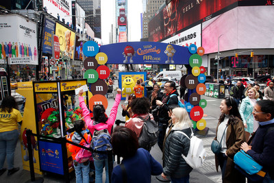 To celebrate the launch of M&M'S Caramel, M&M'S brought a whole new flavor of fun to New York's Times Square by transforming the area's iconic billboards into an innovative augmented reality gaming experience, Thursday, May 11, 2017, in New York. (Photo by Jason DeCrow/Invision for M&M'S/AP Images)