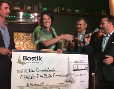 Ted Acworth of Artaic, Mike Jenkins and Scott Banda of Bostik present DNG Grand Prize to designer Lisa Darroh-Pouls. Her mosaic creation “Champagne Wishes” is behind the group.