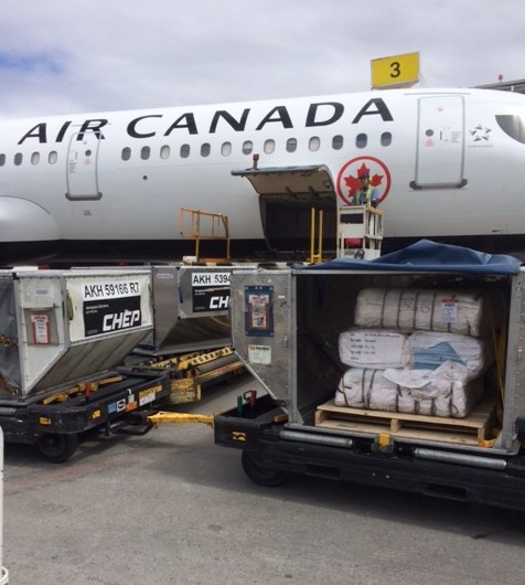 Empty sandbags departing from Calgary (CNW Group/Air Canada)