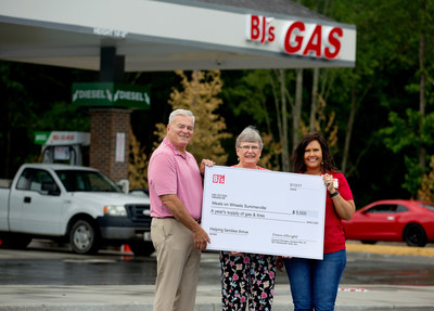 Dawn Albright, General Manager of BJ’s Wholesale Club in Summerville, S.C. (right), presents a donation of a year’s supply of gas and tires to Tony Fowler, chair of the board (left), and Betsy Luke, executive director (center), both of Meals on Wheels Summerville in honor of the grand opening of BJ’s newest gas station.
