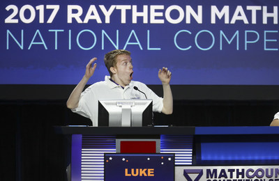Luke Robitaille, the 2017 Raytheon MATHCOUNTS National Champion, answers the final question of the Countdown Round at the Hilton Orlando Lake Buena Vista, Florida. Robitaille, a 13-year-old 7th grader from Euless, Texas was among the 224 U.S. middle-school math students who took part in this year's competition. (credit Damian Strohmeyer Photography)