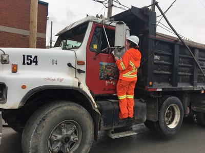 Toronto Hydro, the Electrical Safety Authority and GFL Excavating came together to hand out powerline safety stickers to dump truck drivers in Toronto today. (CNW Group/Toronto Hydro Corporation)