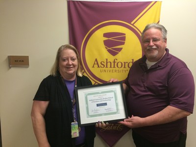 Forbes School of Business and Technology at Ashford University faculty members Drs. Andree Swanson and Ronald Beach with the High Plains Award.