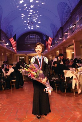 Veronica Tsang of Cathay Bank in the Ellis Island Gallery after being presented with the 2017 Ellis Island Medal of Honor.