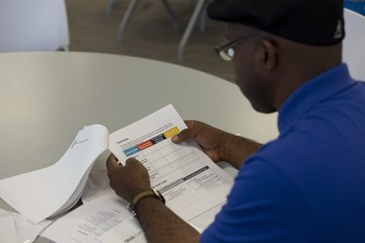 A participant follows along at a small business workshop held at BBVA Compass Plaza in Houston on May 3.