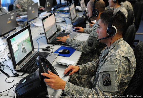 Spc. Fernando Gomez operates a computer-based simulation during a recent exercise facilitated by the 7th Army's Joint Multinational Simulations Center at Grafenwoehr, Germany.