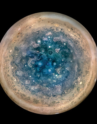 This image shows Jupiter?s south pole, as seen by NASA?s Juno spacecraft from an altitude of 32,000 miles (52,000 kilometers). The oval features are cyclones, up to 600 miles (1,000 kilometers) in diameter. Multiple images taken with the JunoCam instrument on three separate orbits were combined to show all areas in daylight, enhanced color, and stereographic projection. 

Image credit: NASA/JPL-Caltech/SwRI/MSSS/Betsy Asher Hall/Gervasio Robles