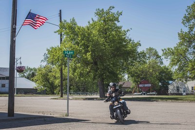 Event staffer Joe Reed rides a Harley-Davidson Street 500 around Ryder, N.D., in anticipation of a Harley-Davidson Riding Academy demonstration Saturday, June 3. The motor company aims to create the first fully motorcycle licensed town. To commemorate the experience, Ryder city officials will change the town’s name to “Riders” this riding season.