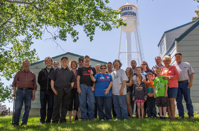 Ryder, N.D. residents gather in front of the town’s newly refurbished water tower, which has become a landmark for motorcycle riders in the Dakotas. To launch riding season, Harley-Davidson will ride into Ryder Saturday, June 3 with the aim of creating the first fully motorcycle licensed town. To commemorate the experience, Ryder city officials will change the town’s name to “Riders” this riding season.