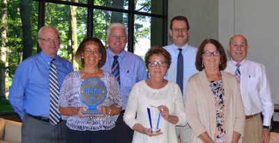 Skyline Corporation's United Way Fundraising Team pictured with the prestigious Hero Award and "Top Donor" recognition.