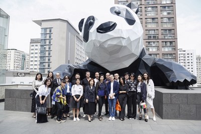 Guests of the first International Style Conference taking photo with “I Am Here”, the one-of-a-kind panda theme public art installation located on the outside wall of Chengdu IFS