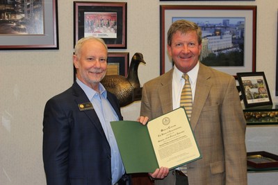 Colorado Rep. Dave Young, D-Greeley, presents a commendation to Hensel Phelps' president and CEO, Jeffrey K. Wenaas, for Hensel Phelps being named a finalist for the 2017 Secretary of Defense Employer Support Freedom Award.