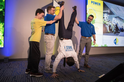 Power Home Remodeling Co-Founder Adam Kaliner does a handstand to kick off the #IStandWithAlex campaign with the help of Alex's Hero and cancer survivor, Cole Fitzgerald.  The social media campaign encourages participants to do a handstand, nominate three friends to participate and share their feat on social media with the hashtag #IStandWithAlex, or donate $10 to ALSF at  www.IStandWithAlex.org.