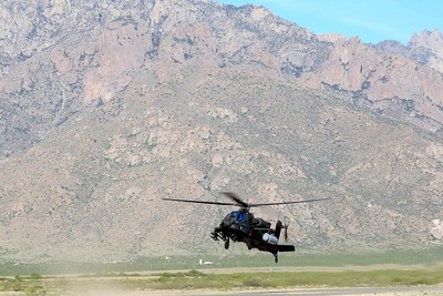 Raytheon and the U.S. Army Apache Program Management Office, in collaboration with U.S. Special Operations Command, recently completed a successful flight test of a high energy laser system onboard an Apache AH-64 at White Sands Missile Range, New Mexico. The demonstration marks the first time that a fully integrated laser system successfully engaged and fired on a target from a rotary-wing aircraft over a wide variety of flight regimes, altitudes and air speeds. Photo courtesy of the U.S. Army