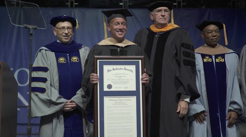 Jordan Zimmerman receiving an honorary degree of Doctorate of Business Administration