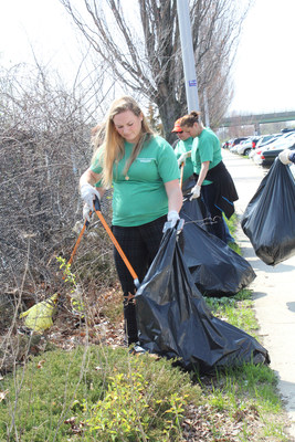 Volunteers at The Nature's Bounty Co. pick up trash in support of Earth Day at the Ronkonkoma, NY LIRR station.