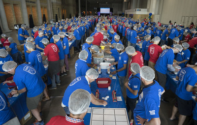 Accenture employees box 15,200 pounds of hunger relief packages, for a total of 100,000 meals donated by the company to the Daily Bread Food Bank during Accenture's annual employee meeting in Toronto, Ont. on Friday, June 16, 2017. The Canadian Press Images PHOTO/Accenture (CNW Group/Accenture)