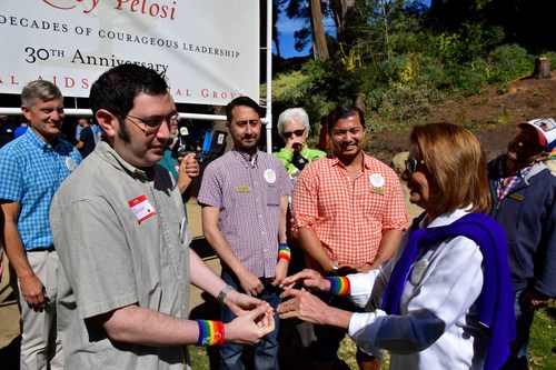 (L-R) Jesse Burgheimer meets Congresswoman Nancy Pelosi as she joins hundreds of volunteers at the National AIDS Memorial, San Francisco, CA for a community volunteer workday to commemorate her 30 years in Congress.  (Photo Credit: Melvin Morris)