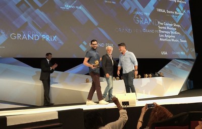 Executive Creative Directors Rafael Rizuto (L) and Eduardo Marques (R) accept the Cannes Lions Grand Prix for Promo and Activation from Jury President Stephane Xiberras on behalf of 180LA for Boost Mobile's Boost Your Voice campaign at the 2017 Cannes Lions Festival.