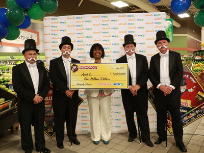 Star Market customer April Carrington celebrates her $1 million prize.