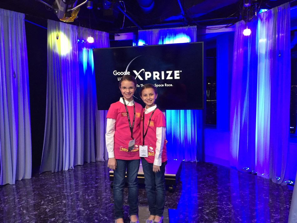 Delaney Robertson (left) and Hadley Robertson (right) at the 2015 Google Lunar XPrize Moonbots Challenge in Tokyo, Japan.