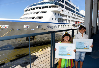 Oceania Cruises recognizes 4-year-old Lorenna D’Amore Nogueira and her brother, 6-year-old Henrique D’Amore Nogueira, as the “Youngest World Cruisers” in front of m/s Insignia while docked in New York, Wednesday, June 28, 2017, during its 180-day Around
the World sailing. (Photo by Diane Bondareff/AP Images for Oceania Cruises)