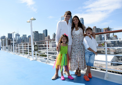 Oceania Cruises recognizes 4-year-old Lorenna D’Amore Nogueira and her brother, 6-year-old Henrique D’Amore Nogueira, as the “Youngest World Cruisers,” as they pose with their parents Drielle and Diego on the deck of m/s Insignia while docked in New York, Wednesday, June 28, 2017, during its 180-day Around the World sailing. (Photo by Diane Bondareff/AP Images for Oceania Cruises)