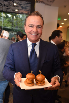 Rick Caruso Enjoying Umami Burger Sliders at the Umami Burger Redesign Launch Party at The Grove in Hollywood