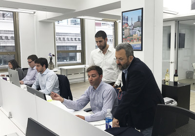 Former Prime Minister Ehud Barak chats with Carbyne employees