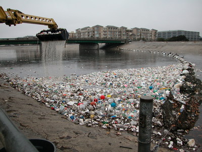 Plastic trash collects at the mouth of the Los Angeles River in Long Beach in the 2002 photo. Nineteen top aquariums today (July 10) launched a nationwide consumer campaign and a business commitment to drive a shift away from single-use plastic among their visitors, in their communities and beyond. The campaign addresses the grave threat posed to aquatic wildlife by plastic pollution. Credit: © Bill McDonald, Algalita Foundation