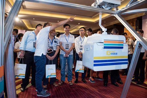 Bardeen (the second left), CTO of iBosst, shows to the audience the Intelligent Logistics Express System.