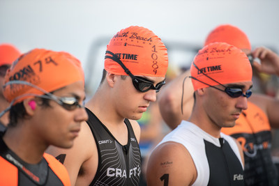 Swimmers prepare to enter the water in a Life Time Tri Series event.