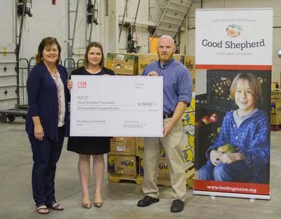 Robert Sorg (right), General Manager of BJ's Wholesale Club in Bangor, Maine, presents a $100,000 grant from the BJ's Charitable Foundation to Melissa Huston (left), Director of Philanthropy at Good Shepherd Food Bank, and Erin Fogg (center), Vice President of Development at Good Shepherd Food Bank.