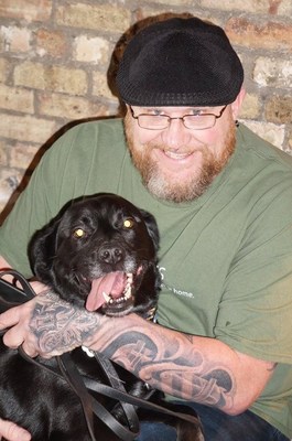 US Navy Veteran, Thomas, with his rescued service dog, Caleb.