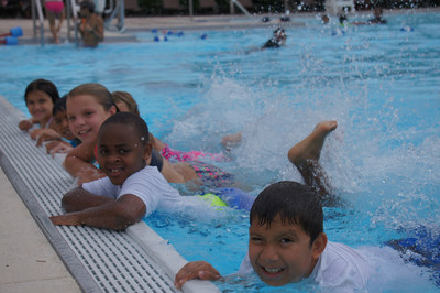 Children happily learning to swim as part of the Red Cross Aquatics Centennial Campaign, City of Haines City Parks and Recreation, Florida