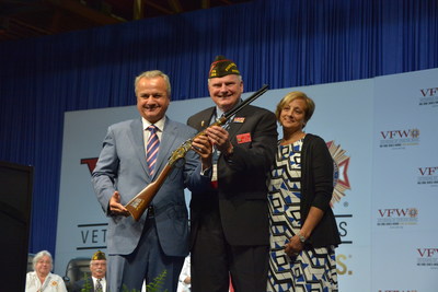 Henry Repeating Arms gifts VFW Service Officer of the Year Raymond Denisewich with a Henry Military Service Tribute Rifle during the Joint Opening Session of the Veterans of Foreign Wars’ 118th National Convention in New Orleans, LA.  Pictured from left: Anthony Imperato, President of Henry Repeating Arms; Raymond Denisewich, VFW Service Officer of the Year and his wife Susan.