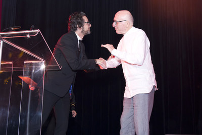 Joseph Ribkoff CEO John Ferraro (left) and Founder Mr. Joseph Ribkoff (right) shake hands during the 60th Anniversary Gala.