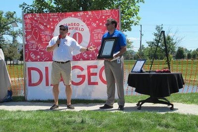 Illinois State Representative Mark Batinick (left) attended Diageo Plainfield's 50th anniversary celebration. During a ceremony, he presented an Illinois Assembly Resolution honoring Diageo Plainfield for 50 years of commitment to the community to Pietro Di Pilato, Diageo's Senior Vice President, Technical. (Photo: Diageo.)