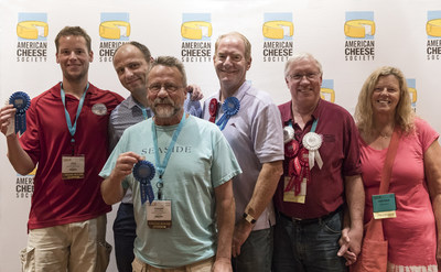 Wisconsin cheesemakers proudly display their awards after the American Cheese Society's annual competition. From left to right: Joey Widmer of Widmer's Cheese Cellars, Marc Druart of Emmi Roth USA, Joe Widmer of Widmer's Cheese Cellars, George Crave of Crave Brothers Farmstead Cheese and Tony and Julie Hook of Hook's Cheese Company.