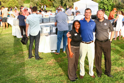 Tesha Young, Director of Corporate Partnerships for the Boys & Girls Clubs of Greater San Diego; John McDonough, Head of Distribution and Marketing at OppenheimerFunds; and Jack Chirrick, Senior Director at Operation Homefront attending a volunteering event during the OppenheimerFunds' Distribution Symposium in San Diego.