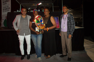 The Ontario Science Centre awarded the eighth annual Innovation in Mas’ Award to Sunlime Canada led by Dwayne Gunness for  Journey to Valhalla at the Peeks Toronto Caribbean Carnival King and Queen Competition and Show. Journey to Valhalla was designed by David Amow and performed by Sileena Amow. Pictured (L to R) Mark Itwaru, Peeks Creator and CEO; Isha Grant accepting the Award on behalf of Sunlime Canada; Denise Herrera-Jackson, CEO, Peeks Toronto Caribbean Carnival; Walter Stoddard, Award Judge and Senior Scientist, Ontario Science Centre. (Photo Credit: Anthony Berot) (CNW Group/Ontario Science Centre)
