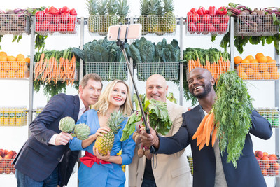 Bobby Flay, Kristen Bell, Tom Colicchio and Taye Diggs take a fruit and vegetable selfie at Naked Juice's #DrinkGoodDoGood campaign launch event in Manhattan. For every selfie shared using the campaign hashtag, Naked Juice will donate 10 pounds of produce to communities in need.